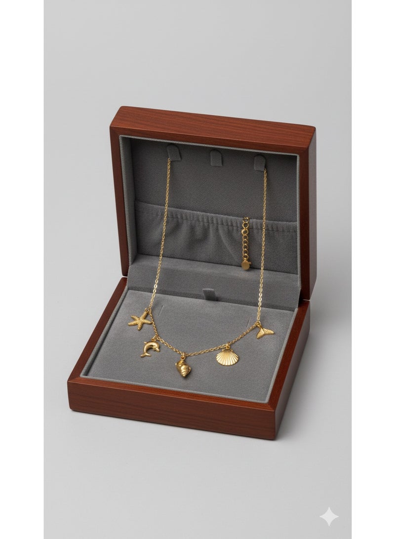 ورد سلسلة ستانلس ستيل ذهبية بتصميم عناصر البحر - دلايات صدف ودولفين. - Image 1